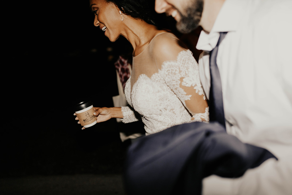 bride holding a professionally designed and custom branded coffee cup.